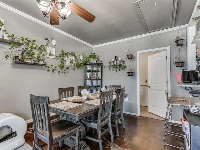 717 SW 4th Pl, Moore, OK 73160 - dining room featuring attic access, crown molding, concrete flooring, a ceiling fan, and baseboards