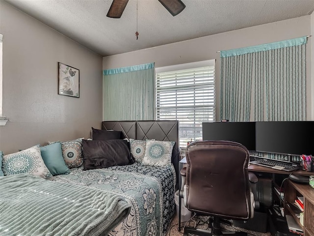 717 SW 4th Pl, Moore, OK 73160 - bedroom featuring a ceiling fan and a textured ceiling