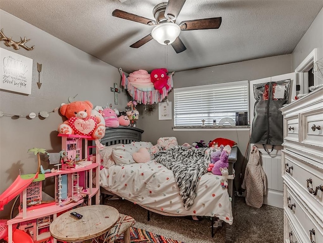 717 SW 4th Pl, Moore, OK 73160 - carpeted bedroom with a textured ceiling and ceiling fan