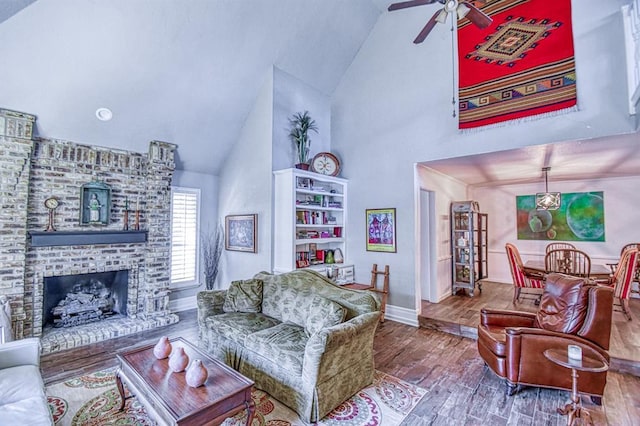 3517 Brookford Dr, Norman, OK 73072 - living area with high vaulted ceiling, ceiling fan, wood finished floors, baseboards, and a fireplace