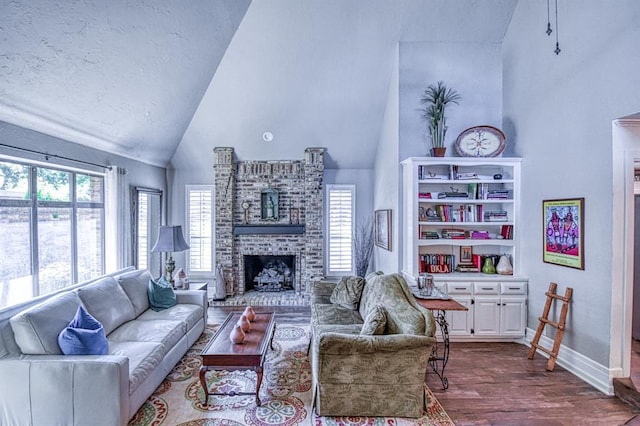 3517 Brookford Dr, Norman, OK 73072 - living area with high vaulted ceiling, a fireplace, dark wood-style flooring, and baseboards