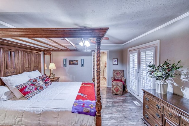 3517 Brookford Dr, Norman, OK 73072 - bedroom featuring wood finished floors, access to outside, ornamental molding, and a textured ceiling