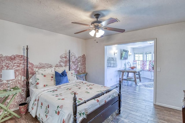 3517 Brookford Dr, Norman, OK 73072 - bedroom with wood finished floors, baseboards, and ceiling fan