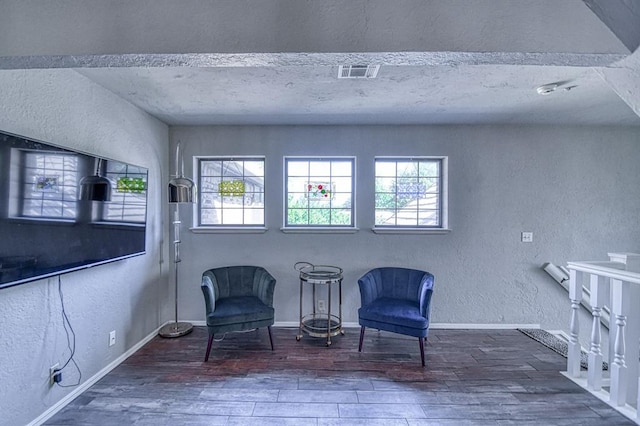 3517 Brookford Dr, Norman, OK 73072 - living area featuring a textured wall, plenty of natural light, wood finished floors, and baseboards
