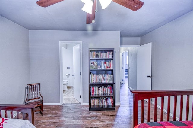 3517 Brookford Dr, Norman, OK 73072 - bedroom featuring wood finished floors, ensuite bathroom, and baseboards