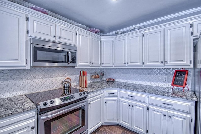 3517 Brookford Dr, Norman, OK 73072 - kitchen with stainless steel appliances, white cabinetry, and tasteful backsplash
