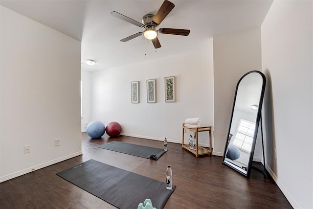 workout room with wood finished floors, ceiling fan, and baseboards