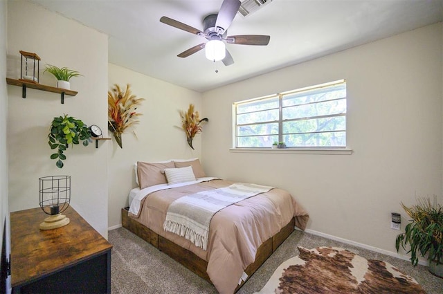308 E Highland St, Hugo, OK 74743 - bedroom with carpet, baseboards, and ceiling fan