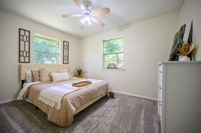 308 E Highland St, Hugo, OK 74743 - bedroom featuring carpet flooring, multiple windows, and baseboards