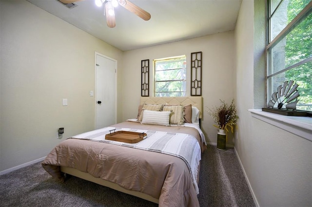 308 E Highland St, Hugo, OK 74743 - bedroom with carpet flooring, baseboards, and ceiling fan