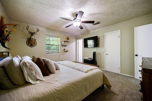 308 E Highland St, Hugo, OK 74743 - carpeted bedroom featuring a textured ceiling and a ceiling fan