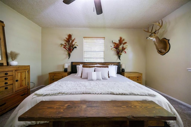 308 E Highland St, Hugo, OK 74743 - carpeted bedroom featuring a textured ceiling, a ceiling fan, and baseboards