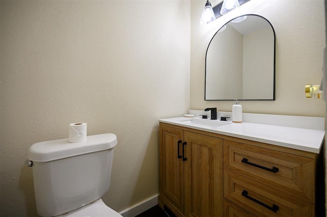 308 E Highland St, Hugo, OK 74743 - bathroom with vanity and toilet