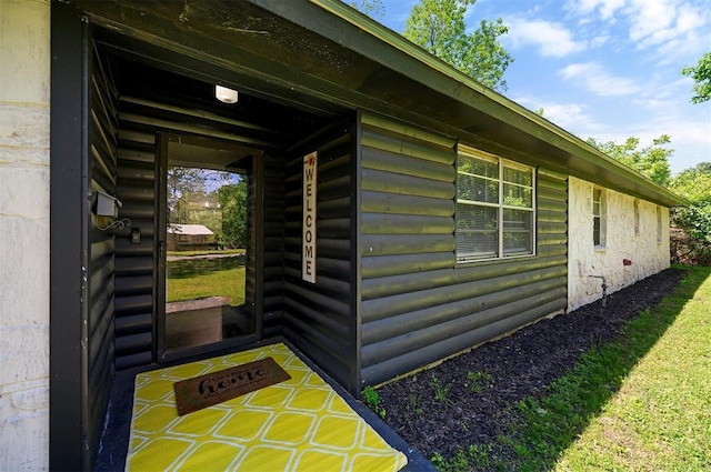308 E Highland St, Hugo, OK 74743 - property entrance featuring faux log siding