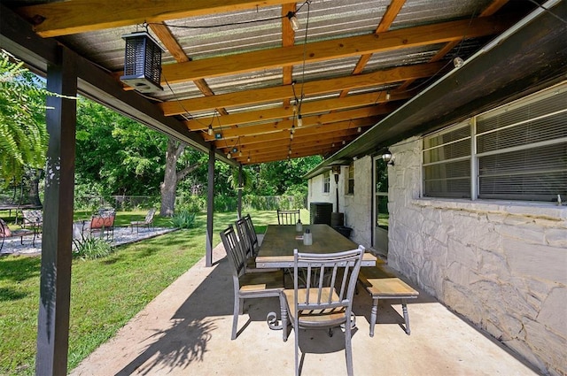 308 E Highland St, Hugo, OK 74743 - view of patio with outdoor dining space and cooling unit