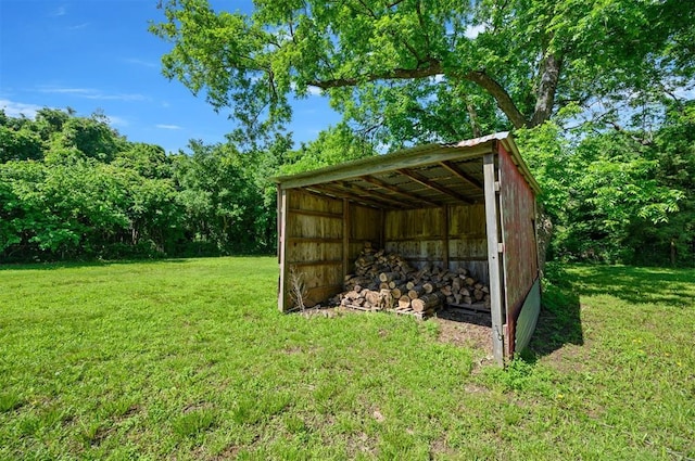 308 E Highland St, Hugo, OK 74743 - view of pole building with a yard and a carport