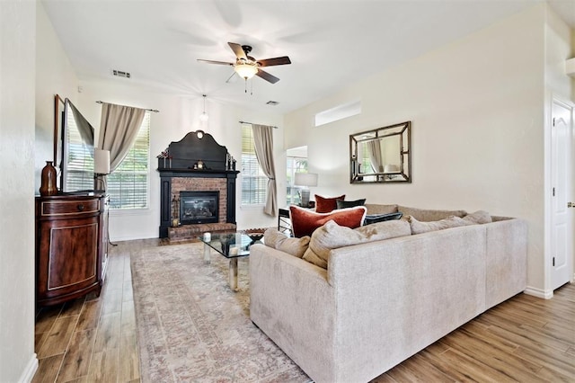3005 Summit Hill Rd, Norman, OK 73071 - living room featuring a ceiling fan, wood finished floors, a fireplace, and baseboards