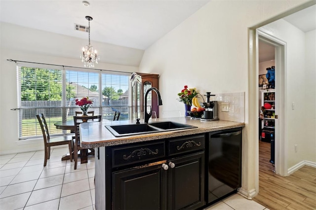 3005 Summit Hill Rd, Norman, OK 73071 - kitchen featuring dishwasher, a sink, lofted ceiling, plenty of natural light, and dark cabinetry