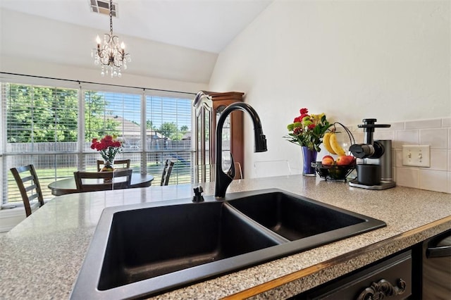 3005 Summit Hill Rd, Norman, OK 73071 - kitchen view of a sink, pendant lighting, light countertops, and a chandelier