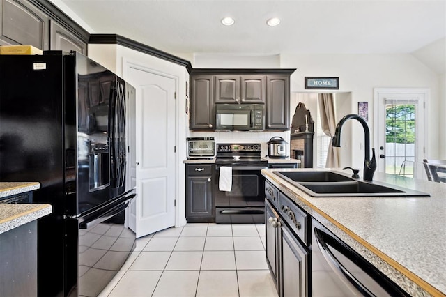 3005 Summit Hill Rd, Norman, OK 73071 - kitchen with black appliances, a sink, backsplash, light countertops, and recessed lighting