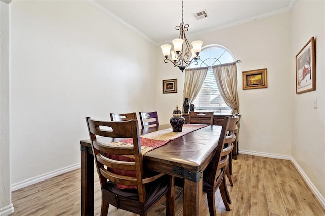 3005 Summit Hill Rd, Norman, OK 73071 - dining area featuring a chandelier, light wood-style floors, ornamental molding, and baseboards