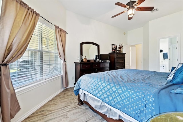 3005 Summit Hill Rd, Norman, OK 73071 - bedroom with multiple windows, wood finished floors, baseboards, and a ceiling fan
