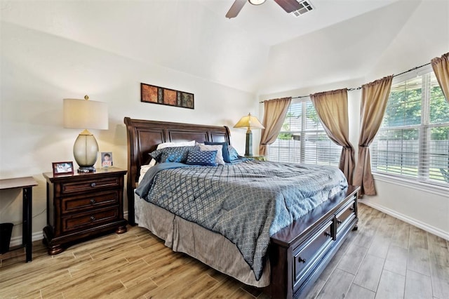 3005 Summit Hill Rd, Norman, OK 73071 - bedroom featuring multiple windows, light wood-style flooring, baseboards, and lofted ceiling