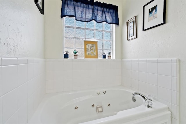 3005 Summit Hill Rd, Norman, OK 73071 - full bathroom with a tub with jets and a textured wall
