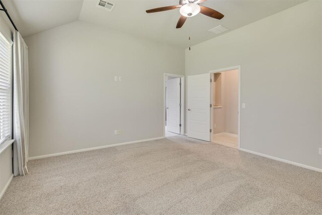 6812 NW 149th St, Oklahoma City, OK 73142 - unfurnished bedroom with light carpet, multiple windows, vaulted ceiling, and ceiling fan