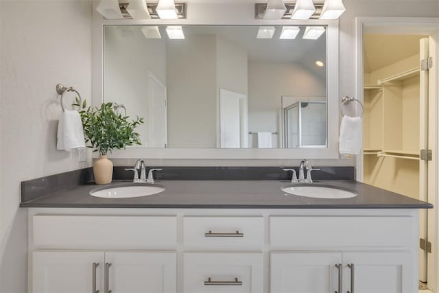 6812 NW 149th St, Oklahoma City, OK 73142 - full bathroom featuring double vanity and a shower with door