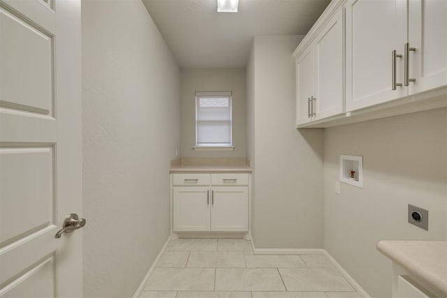 6812 NW 149th St, Oklahoma City, OK 73142 - laundry room featuring cabinet space, hookup for an electric dryer, hookup for a washing machine, and light tile patterned floors