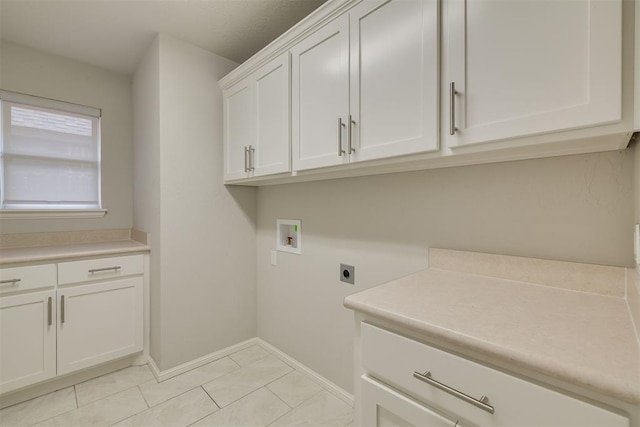 6812 NW 149th St, Oklahoma City, OK 73142 - washroom featuring hookup for an electric dryer, cabinet space, washer hookup, and light tile patterned floors