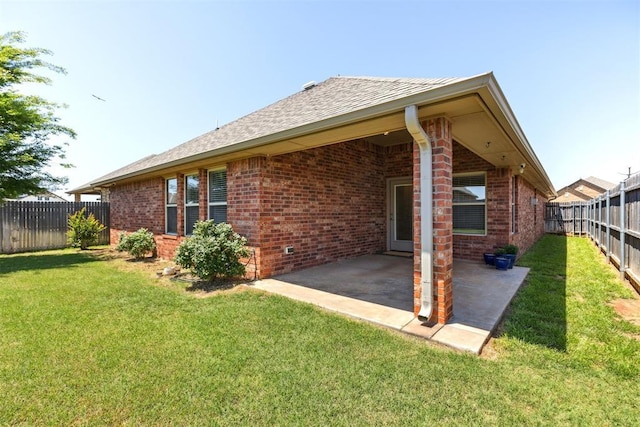 6812 NW 149th St, Oklahoma City, OK 73142 - back of house featuring brick siding, a fenced backyard, a patio, and a shingled roof