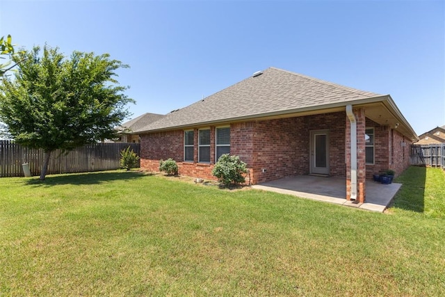 6812 NW 149th St, Oklahoma City, OK 73142 - rear view of property featuring a fenced backyard, brick siding, a patio area, and a shingled roof