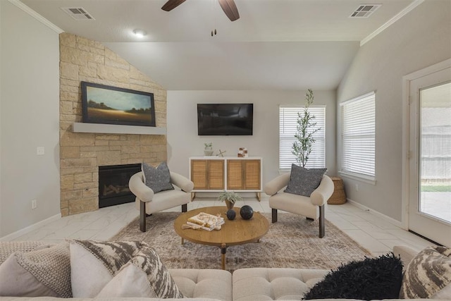 6812 NW 149th St, Oklahoma City, OK 73142 - living room with lofted ceiling, crown molding, a stone fireplace, a ceiling fan, and plenty of natural light