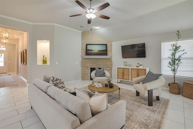 6812 NW 149th St, Oklahoma City, OK 73142 - living room featuring ceiling fan, a fireplace, vaulted ceiling, a chandelier, and crown molding