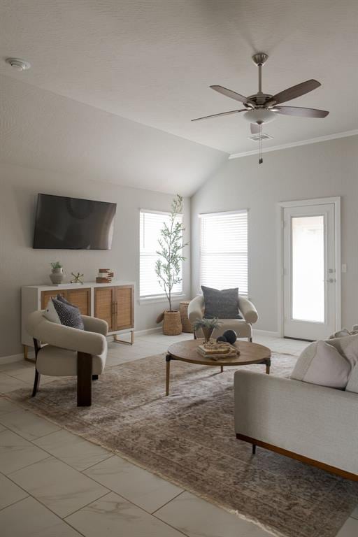 6812 NW 149th St, Oklahoma City, OK 73142 - living room featuring a ceiling fan, light marble finish floors, lofted ceiling, and ornamental molding