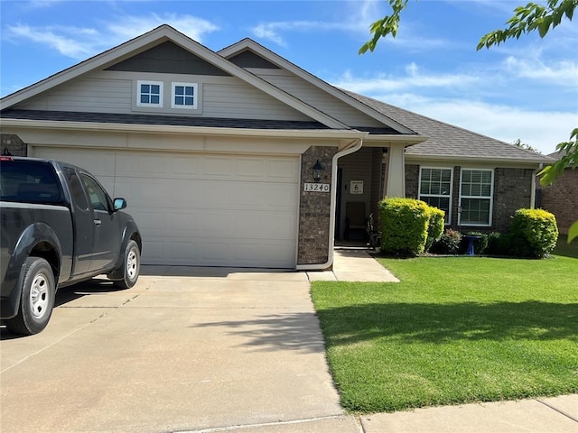 ranch-style house featuring driveway, an attached garage, a front lawn, and a shingled roof