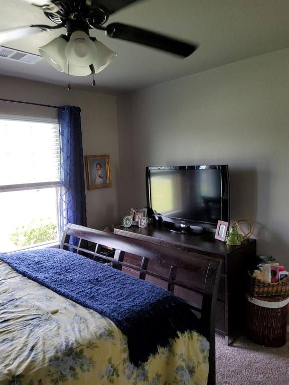 carpeted bedroom featuring ceiling fan