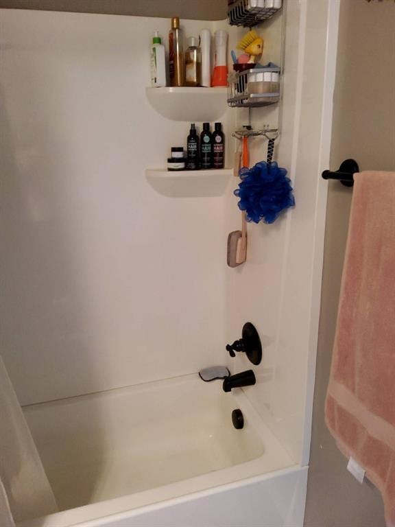 bathroom featuring shower / tub combo with curtain