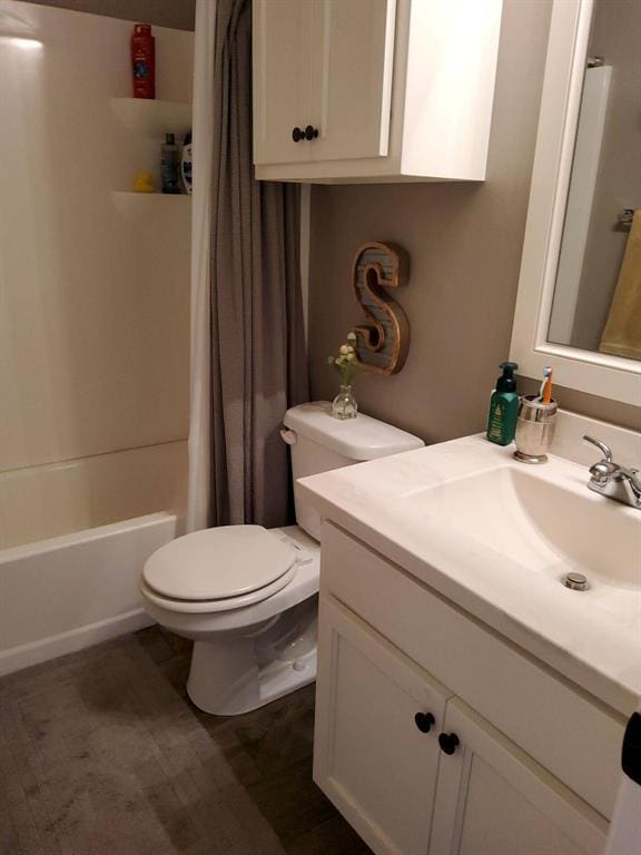 full bathroom with toilet, vanity, and shower / bathtub combination with curtain