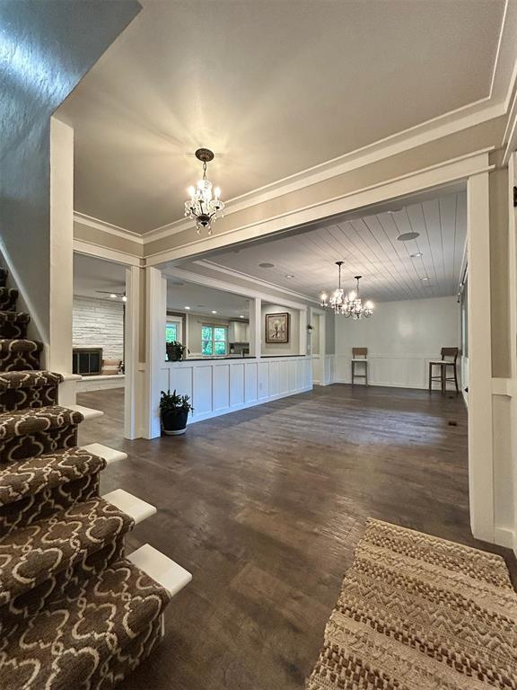 4008 Creekwood, Edmond, OK 73025 - common area with a decorative wall, ornamental molding, and wainscoting