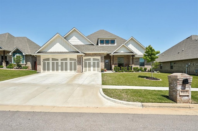 craftsman house with an attached garage, driveway, a front lawn, board and batten siding, and brick siding