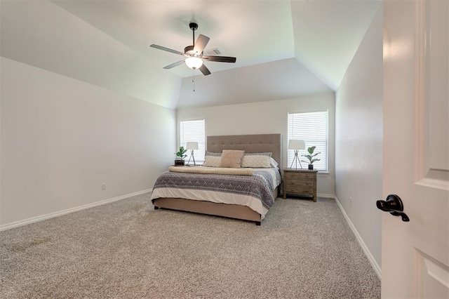 carpeted bedroom with lofted ceiling, baseboards, and a ceiling fan