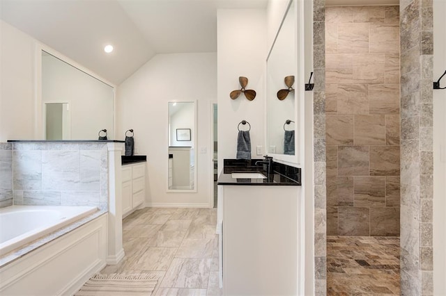 bathroom with vanity, a bath, lofted ceiling, tiled shower, and marble finish floors