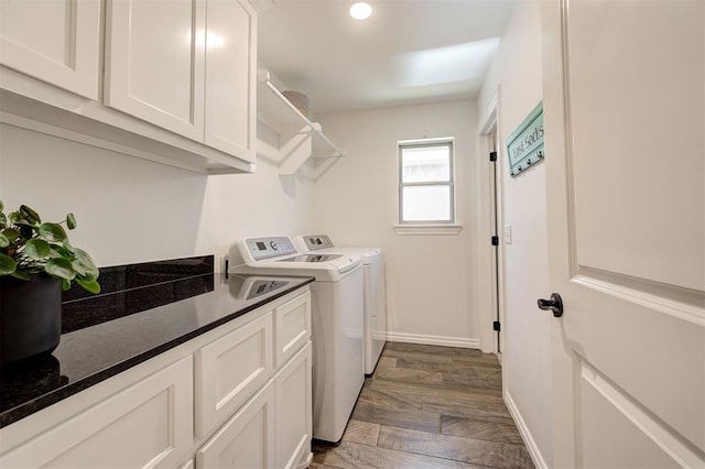 clothes washing area with washer and clothes dryer, baseboards, cabinet space, and recessed lighting