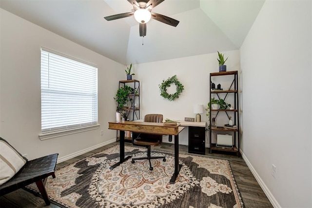 office space with ceiling fan, vaulted ceiling, baseboards, and wood finished floors