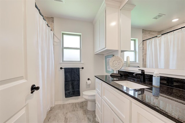 full bath with toilet, marble look tile flooring, vanity, baseboards, and a shower with curtain