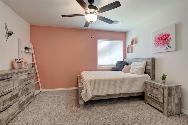 bedroom with light colored carpet, ceiling fan, and baseboards