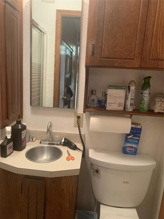 845 N Washington Ave, Mountain View, OK 73062 - bathroom featuring toilet and vanity